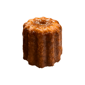 A canelé cut open to show the custardy core