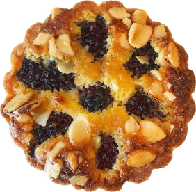 An almond cream tart studded with blackberries and sliced almonds, seen from above